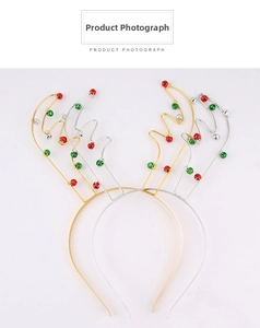 Detail view of gold and silver reindeer antler headbands with red and green mini bells