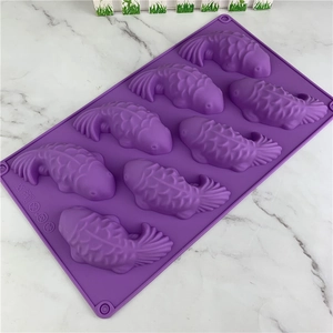 Purple 8-cavity koi fish silicone mold for cake decorating and chocolate crafting