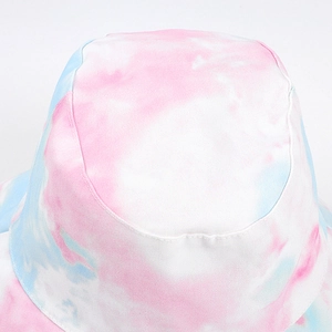 Close-up of pink and blue tie-dye canvas texture on a stylish bucket hat