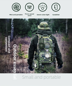 Mini portable fan with lanyard and carabiner clip attached to an outdoor hiking backpack