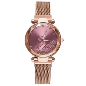 Detailed macro of rose gold mesh band watch with purple dial and crystal swan motif