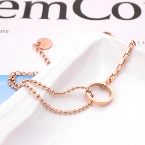 Double-layered rose gold titanium steel bracelet with beads and rectangular links