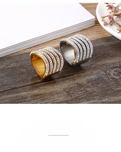 Macro detail of multi-layer sparkling stainless steel rings with crystal paving