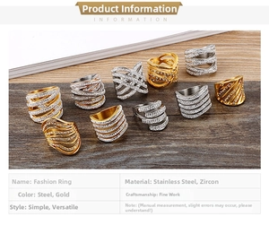 Detail of silver and gold stainless steel rings with zircon pave multi-layer design