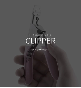 Detailed close-up of a pink U-shaped nail clipper with sharp stainless steel blade