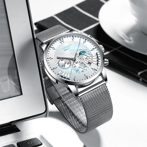 Detail of GADYSON silver Milanese mesh strap and white textured dial quartz watch