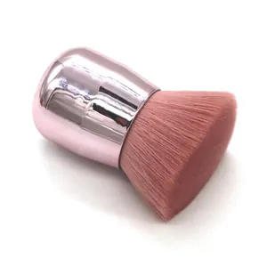 Detail view of portable retractable makeup brush with rose gold handle and pink soft bristles