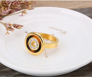 Detailed view of a rose gold shell ring with tortoiseshell inlay and zircon accents