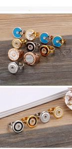 Detail of rose gold rings with roman numerals, mother of pearl and shell inlays