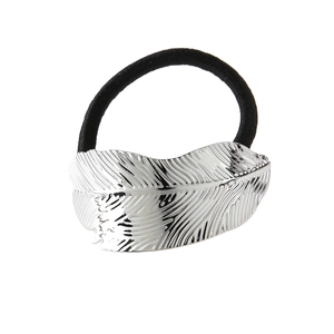 Minimalist silver metal leaf hair tie with embossed texture and black elastic band