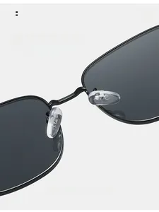 Macro detail of comfortable silicone nose pads on black metal frame sunglasses