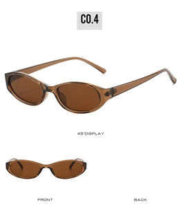 Close-up of retro oval sunglasses with amber translucent frames and UV protection lenses
