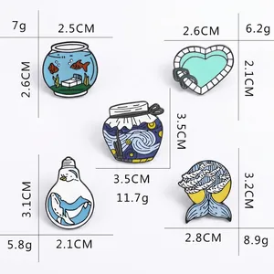 Five unique creative enamel pins featuring fish tank, starry night, and whale designs
