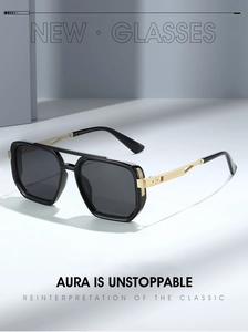 Detail of pilot sunglasses showing golden hollow metal temples and black frame design