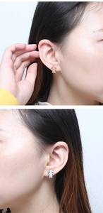 Detailed view of gold and silver cartoon girl stud earrings worn by a model