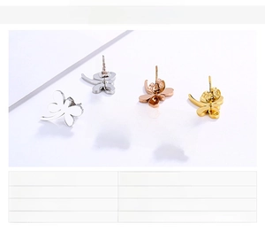 Detailed view of dragonfly stud earrings in gold, silver, and rose gold stainless steel