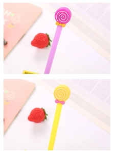 Detail of candy lollipop gel pens with swirl patterns and cute bow tie decorations