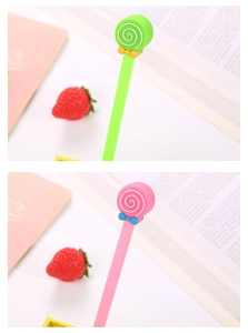 Close-up of cute lollipop-shaped gel pens with silicone bow tie decor in pink and green