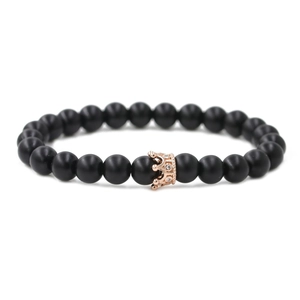 Matte black stone beaded bracelet with a rose gold crown and sparkling zircon inlay