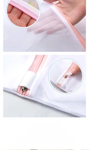 Detail of fine mesh laundry bag with pink self-locking zipper and reinforced seams