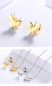 Detailed view of elegant gold and silver butterfly necklace and stud earrings jewelry set