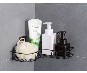 Detail of black corner shower shelf with hollow drainage design and adhesive mounting