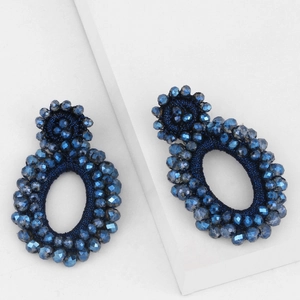 Detailed view of handmade navy blue seed bead earrings with faceted glass dangles