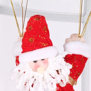 Close-up of plush Santa Claus ornament with golden glitter details and a hanging rope