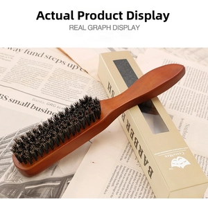 Detail of wooden men's hairbrush with boar bristles and premium packaging box
