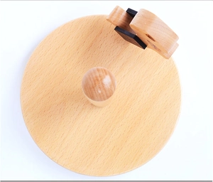 Top view of circular beech wood paper towel holder with a cute elephant figurine detail