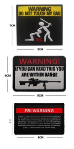 Detailed view of three tactical patches with warning text and high-quality embroidery