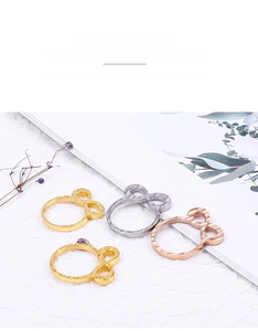 Detailed view of hammered stainless steel rings with geometric hollow palm design