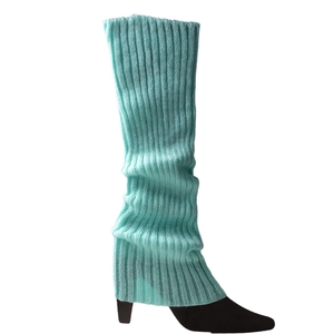 Detailed knit texture of mint green ribbed leg warmers worn with black high heels