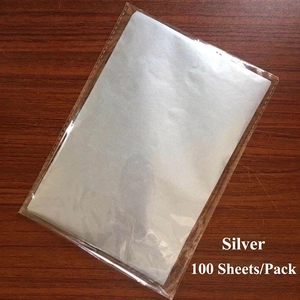 Macro shot of 100 sheets of silver A5 thin tissue paper in transparent PP packaging bag