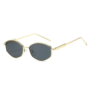 Retro hexagonal sunglasses with gold metal frames and dark grey lenses in 45-degree view