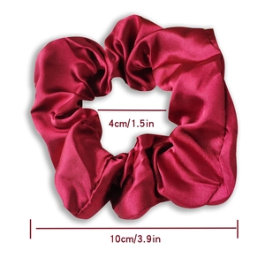 Red satin fabric scrunchie with smooth silk texture and dimensions 10cm outer diameter