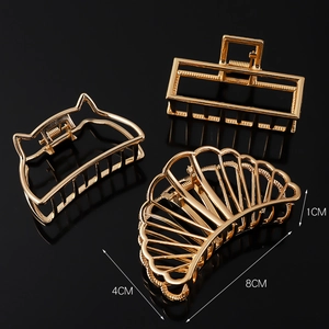 Three-piece gold metal hair claw clip set with dimensions 8cm by 4cm for women