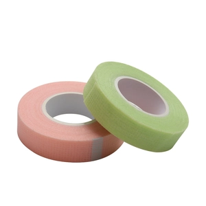 Pink and green breathable non-woven tape for eyelash extensions on white background