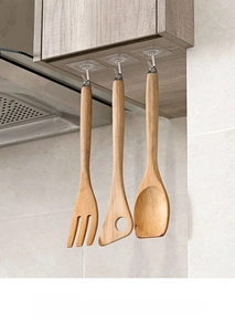 Strong transparent adhesive hooks for kitchen storage holding wooden cooking utensils