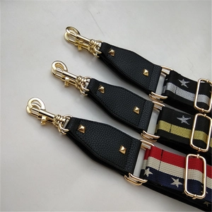Detailed view of adjustable leopard and geometric patterned wide shoulder bag straps with gold hardware