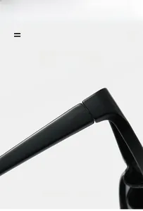 Detail of the high-gloss black hinge on lightweight and super elastic sunglasses