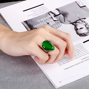 Retro titanium steel ring featuring a large teardrop green cat's eye stone for women
