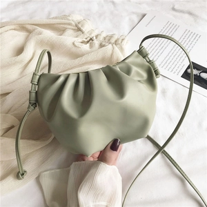 Detail of light bean green pleated cloud bag with soft PU leather texture and ins style