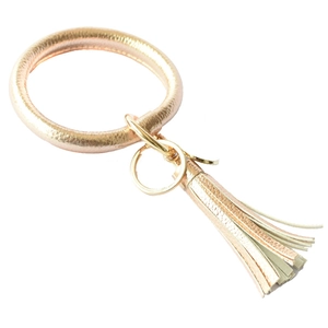 Champagne gold PU leather bracelet keychain with tassel and metal ring clasp detail