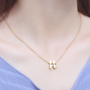 Gold-plated stainless steel necklace with stylized hand-holding pendant on a snake chain