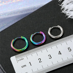 Detailed view of 12mm stainless steel hoop earrings in silver and rainbow finish with ruler