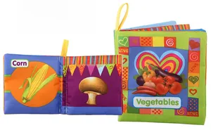 Detail of vegetable cloth book showing colorful corn and mushroom patterns for baby learning