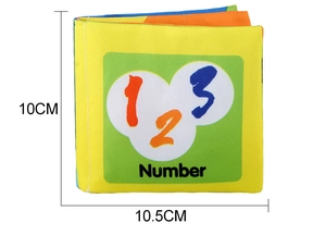 Detail view of baby cloth book showing 10cm square size and cartoon number patterns