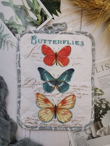 Detail of quilted cotton baking mat featuring vintage butterfly print and fine stitching