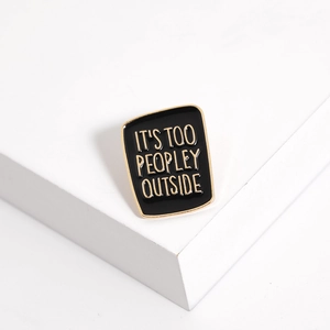 Detail of enamel lapel pin with It's Too Peopley Outside text on white display